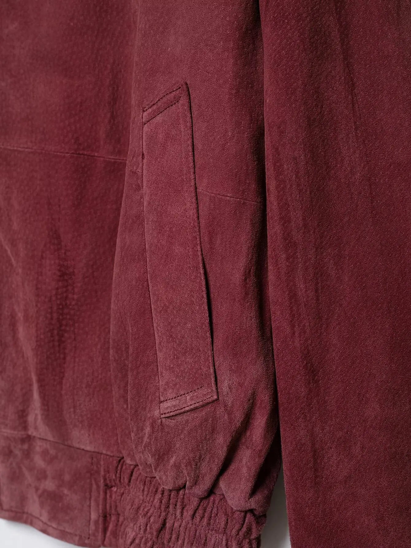 Front welt pocket and elasticated hem detail