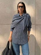 Navy plaid scarf-tie shirt worn with denim