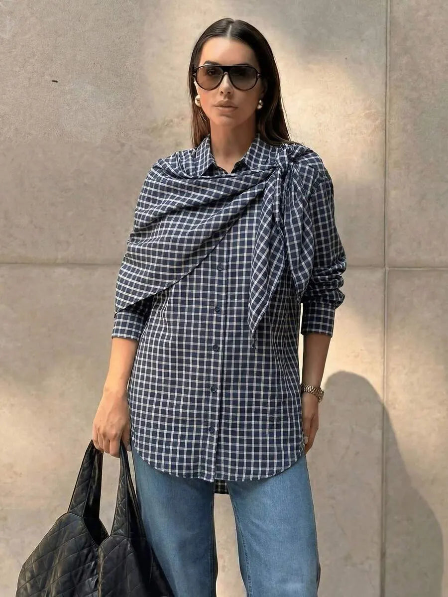 Navy plaid scarf-tie shirt worn with denim
