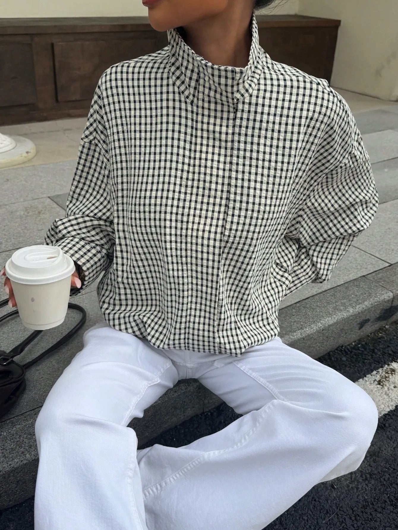 Black gingham funnel-neck jacket detail
