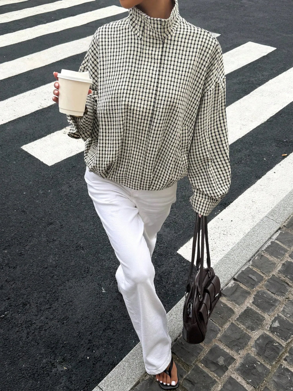 Black gingham funnel-neck jacket, walking