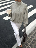 Black gingham funnel-neck jacket, walking
