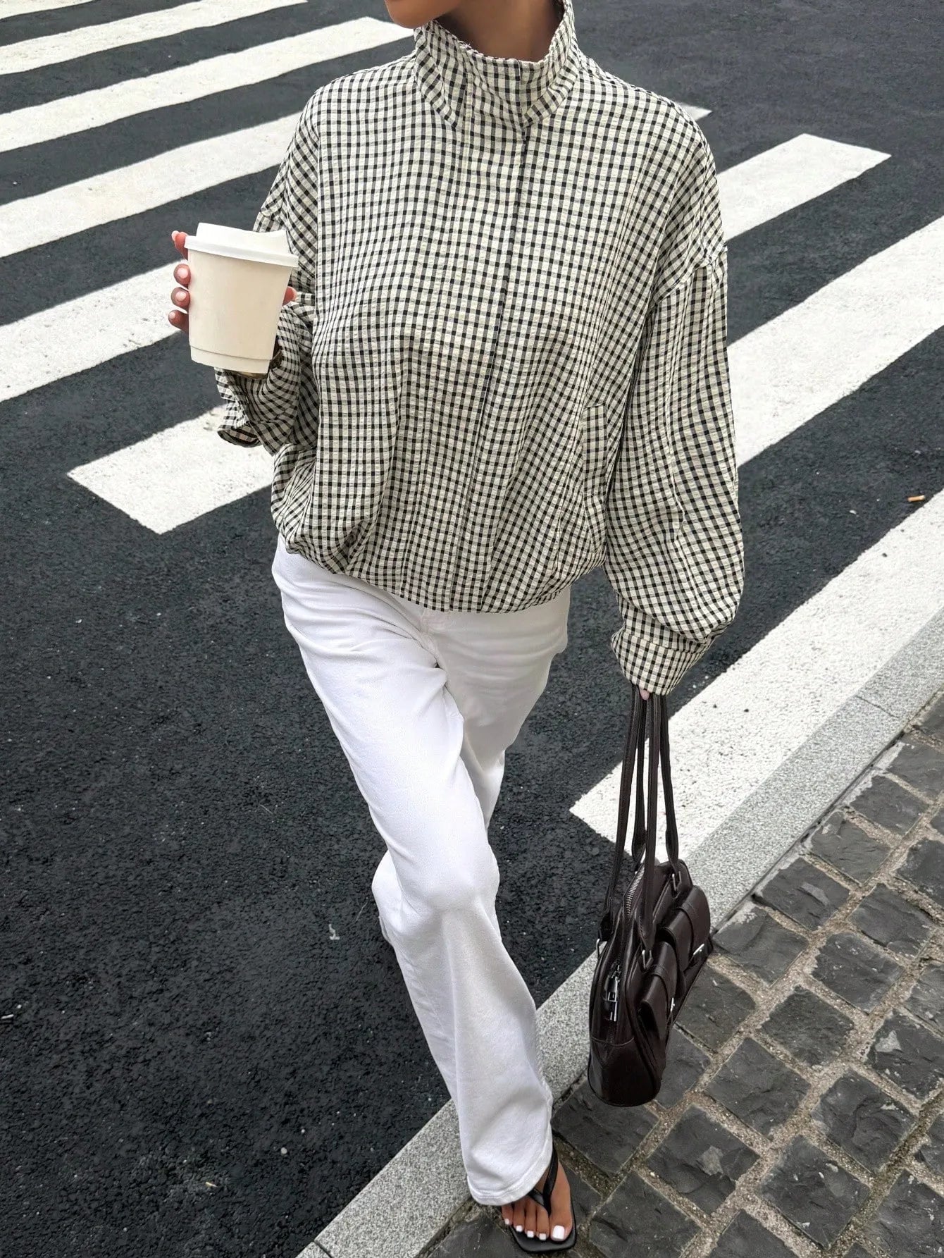 Black gingham funnel-neck jacket, walking