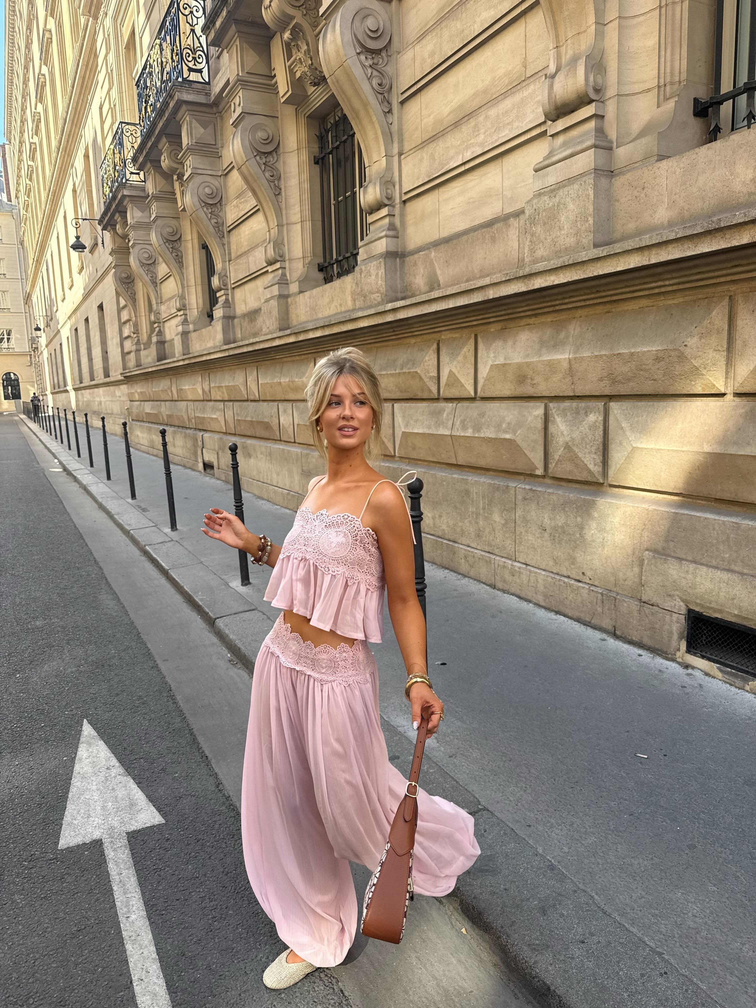 Pink lace cami and wide-leg trouser set, walking