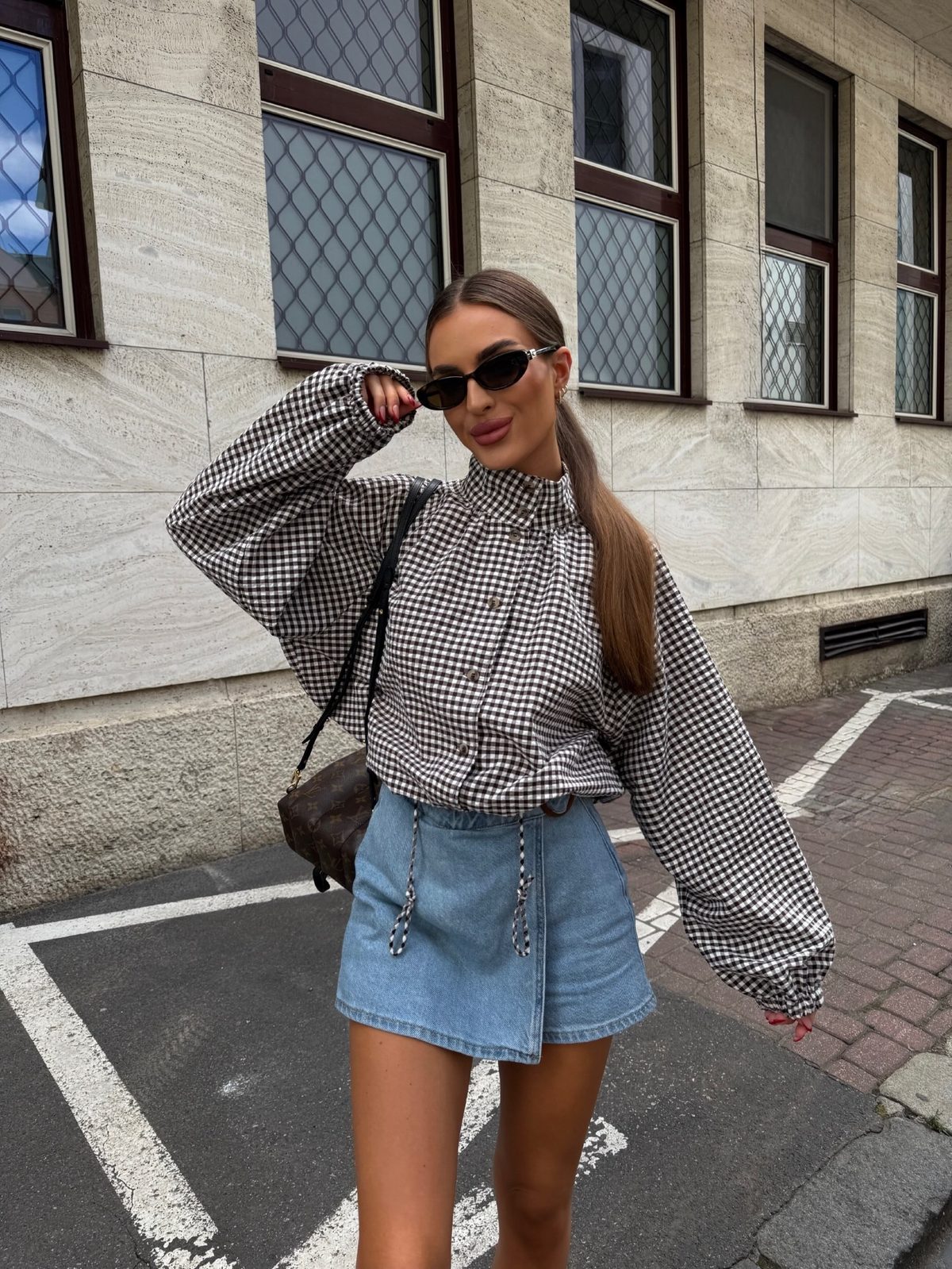 AW26 email — black gingham funnel-neck jacket with denim mini skirt