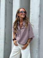 AW26 email — burgundy gingham shirt with white wide-leg jeans