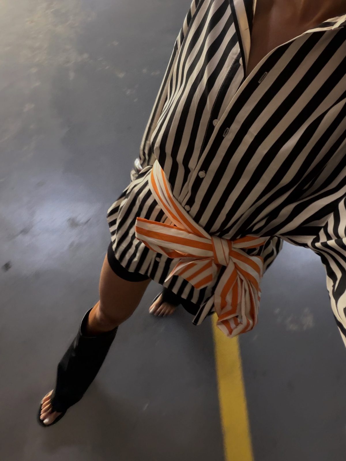 AW26 email — striped shirt belted with contrast orange tie
